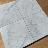 Italian Bianco Carrara marble slab with soft gray veining from Sapphirus Stone in Toronto. Ideal for kitchens, bathrooms, and luxury interiors.