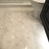 Italian Bianco Carrara marble slab with soft gray veining from Sapphirus Stone in Toronto. Ideal for kitchens, bathrooms, and luxury interiors.