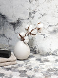 Invisible Grey Marble tile with flowing white and gold veining from Sapphirus Stone Toronto. Ideal for modern feature walls and luxury flooring.