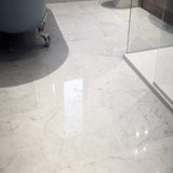 Italian Bianco Carrara marble slab with soft gray veining from Sapphirus Stone in Toronto. Ideal for kitchens, bathrooms, and luxury interiors.