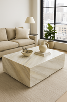 Ajax Gold natural marble slab with honed finish, featuring soft gold and beige veining on a creamy white background—ideal for luxury interiors, countertops, and wall applications.