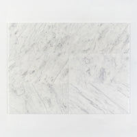 White marble tile with gray veins on a white background