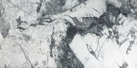 Invisible Grey Marble tile with flowing white and gold veining from Sapphirus Stone Toronto. Ideal for modern feature walls and luxury flooring.