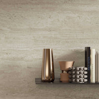 Close-up of Travertine Marvel Light porcelain tile showing soft veining and matte finish