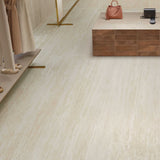 Travertine Marvel Light 24x48 wall and floor tile in contemporary commercial lobby design