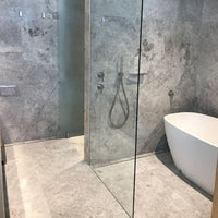 Tundra Grey Marble tile with soft grey background and white veining from Sapphirus Stone in Toronto. Ideal for modern floors, walls, and bathrooms.