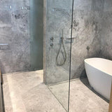 Tundra Grey Marble tile with soft grey background and white veining from Sapphirus Stone in Toronto. Ideal for modern floors, walls, and bathrooms.